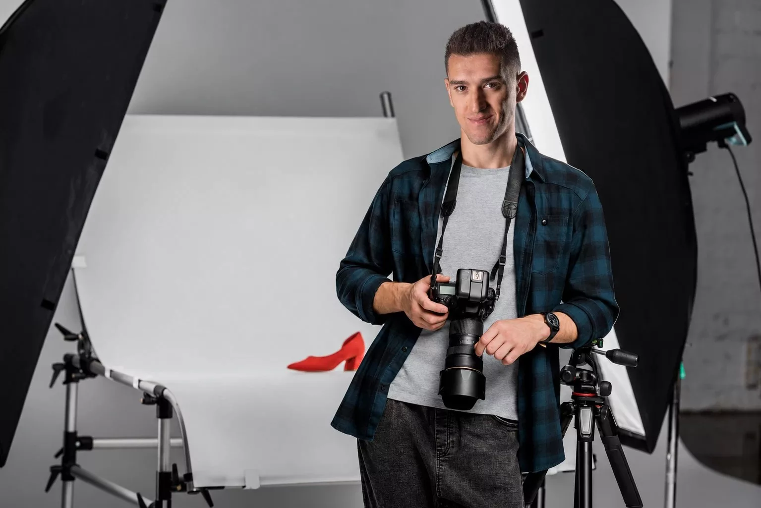 Edward George, photographer, in his studio with a camera